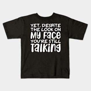 yet despite the look on my face you're still talking Kids T-Shirt